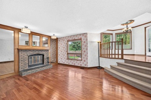 2509 Douglas Woods Link Se, Calgary, AB - Indoor Photo Showing Other Room With Fireplace