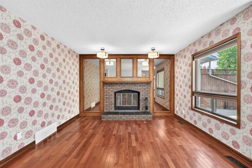 2509 Douglas Woods Link Se, Calgary, AB - Indoor Photo Showing Living Room With Fireplace