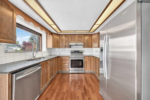 2509 Douglas Woods Link Se, Calgary, AB - Indoor Photo Showing Kitchen With Double Sink