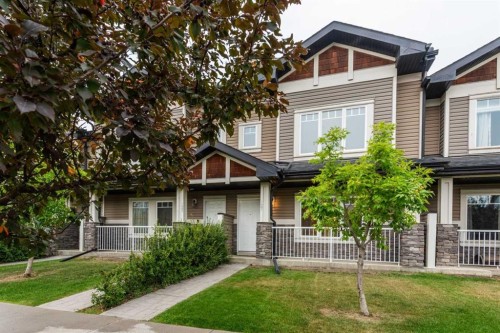 127 Prestwick Villas Se, Calgary, AB - Outdoor With Deck Patio Veranda With Facade