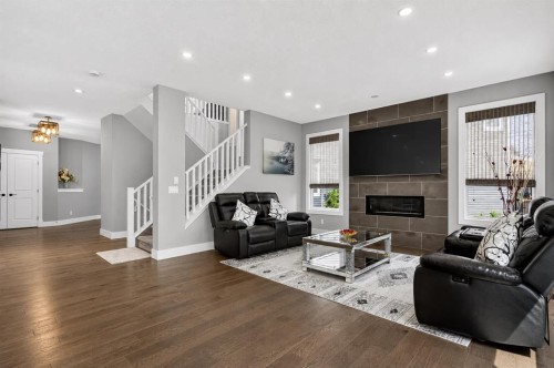 108 Kinniburgh Close, Chestermere, AB - Indoor Photo Showing Living Room With Fireplace