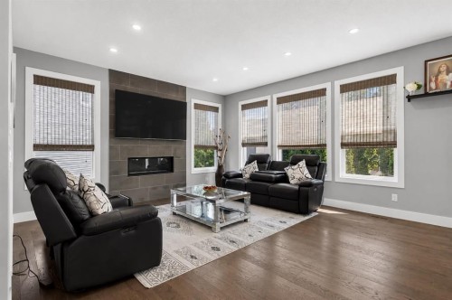 108 Kinniburgh Close, Chestermere, AB - Indoor Photo Showing Living Room With Fireplace
