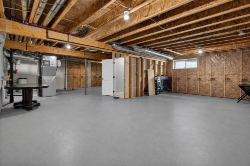 108 Kinniburgh Close, Chestermere, AB - Indoor Photo Showing Basement