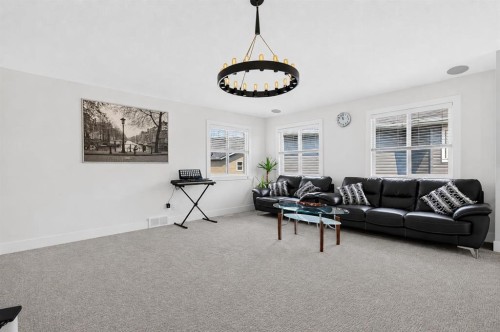 108 Kinniburgh Close, Chestermere, AB - Indoor Photo Showing Living Room
