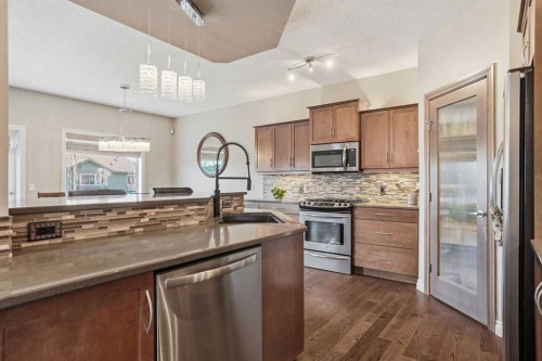 133 Aspen Stone Road Sw, Calgary, AB - Indoor Photo Showing Kitchen With Stainless Steel Kitchen With Upgraded Kitchen