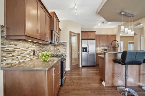 133 Aspen Stone Road Sw, Calgary, AB - Indoor Photo Showing Kitchen With Stainless Steel Kitchen With Upgraded Kitchen