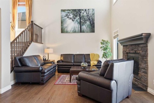 133 Aspen Stone Road Sw, Calgary, AB - Indoor Photo Showing Living Room With Fireplace
