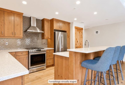 209-707 Spring Creek Drive, Canmore, AB - Indoor Photo Showing Kitchen With Upgraded Kitchen