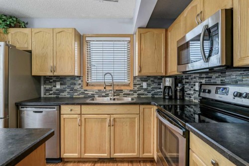 511 Killarney Glen Court Sw, Calgary, AB - Indoor Photo Showing Kitchen With Double Sink