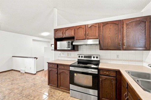 279 Coral Springs Circle Ne, Calgary, AB - Indoor Photo Showing Kitchen With Double Sink