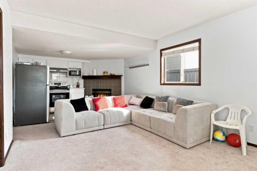 279 Coral Springs Circle Ne, Calgary, AB - Indoor Photo Showing Living Room With Fireplace