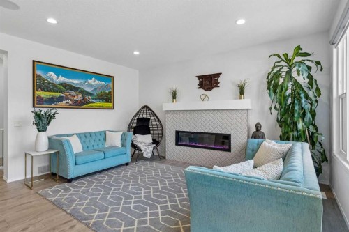 159 Belmont Terrace Sw, Calgary, AB - Indoor Photo Showing Living Room With Fireplace