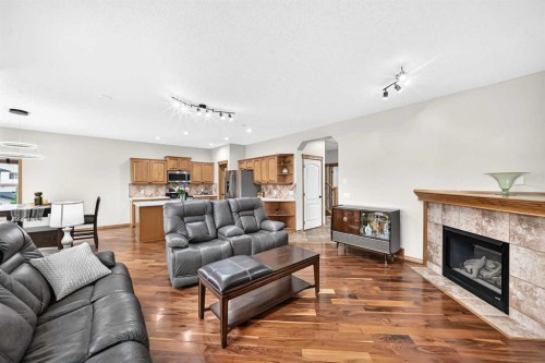 145 Panamount Place Nw, Calgary, AB - Indoor Photo Showing Living Room With Fireplace