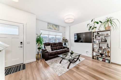 109-525 River Heights Drive, Cochrane, AB - Indoor Photo Showing Living Room