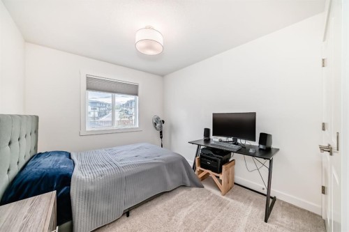 109-525 River Heights Drive, Cochrane, AB - Indoor Photo Showing Bedroom