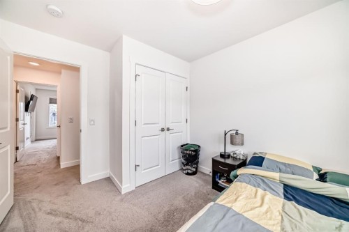 109-525 River Heights Drive, Cochrane, AB - Indoor Photo Showing Bedroom