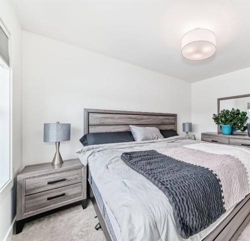 109-525 River Heights Drive, Cochrane, AB - Indoor Photo Showing Bedroom