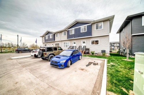 109-525 River Heights Drive, Cochrane, AB - Outdoor With Exterior