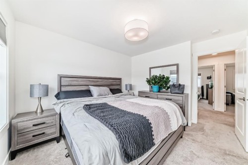 109-525 River Heights Drive, Cochrane, AB - Indoor Photo Showing Bedroom