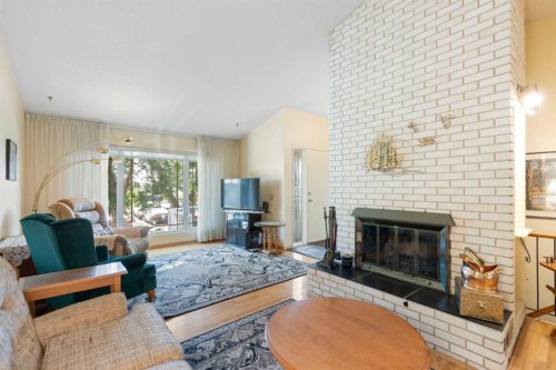 243 Radcliffe Place Se, Calgary, AB - Indoor Photo Showing Living Room With Fireplace
