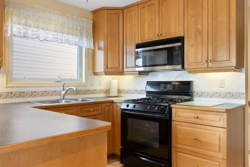 243 Radcliffe Place Se, Calgary, AB - Indoor Photo Showing Kitchen With Double Sink