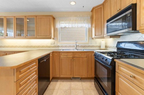 243 Radcliffe Place Se, Calgary, AB - Indoor Photo Showing Kitchen With Double Sink