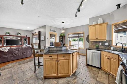 1418 Kings Heights Boulevard Se, Airdrie, AB - Indoor Photo Showing Kitchen With Double Sink
