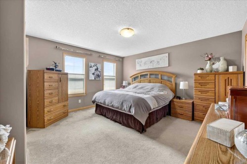 1418 Kings Heights Boulevard Se, Airdrie, AB - Indoor Photo Showing Bedroom