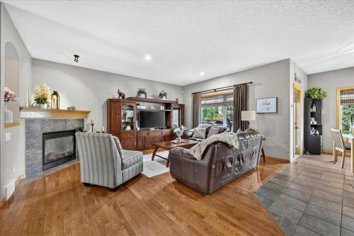 1418 Kings Heights Boulevard Se, Airdrie, AB - Indoor Photo Showing Living Room With Fireplace