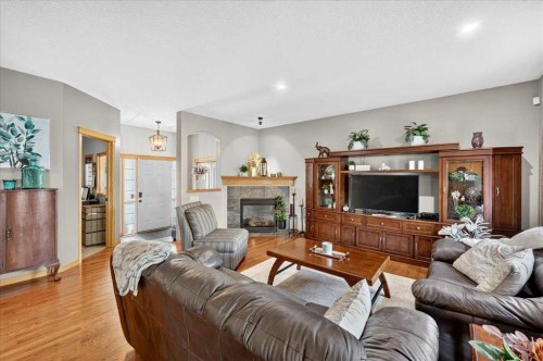 1418 Kings Heights Boulevard Se, Airdrie, AB - Indoor Photo Showing Living Room With Fireplace