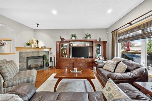 1418 Kings Heights Boulevard Se, Airdrie, AB - Indoor Photo Showing Living Room With Fireplace