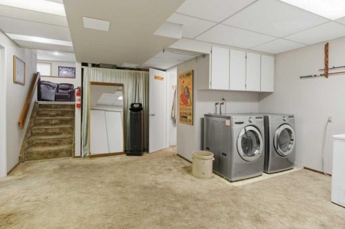 9511 Academy Drive Se, Calgary, AB - Indoor Photo Showing Laundry Room