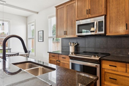 70 Cortina Way Sw, Calgary, AB - Indoor Photo Showing Kitchen With Double Sink