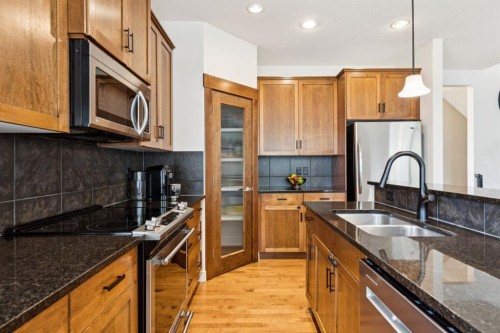 70 Cortina Way Sw, Calgary, AB - Indoor Photo Showing Kitchen With Double Sink With Upgraded Kitchen
