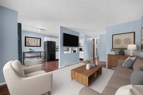 12-14736 Deerfield Drive Se, Calgary, AB - Indoor Photo Showing Living Room
