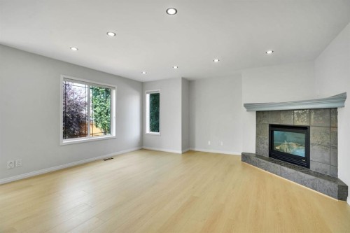 191 Cranwell Crescent Se, Calgary, AB - Indoor Photo Showing Living Room With Fireplace
