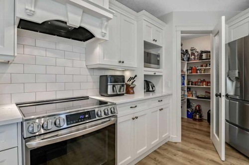 9 Sheep River Heath, Okotoks, AB - Indoor Photo Showing Kitchen With Stainless Steel Kitchen