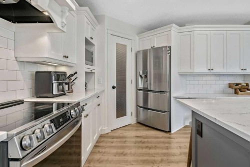 9 Sheep River Heath, Okotoks, AB - Indoor Photo Showing Kitchen With Stainless Steel Kitchen With Upgraded Kitchen