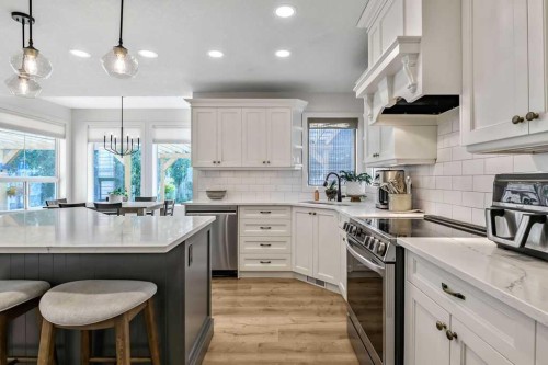 9 Sheep River Heath, Okotoks, AB - Indoor Photo Showing Kitchen With Upgraded Kitchen