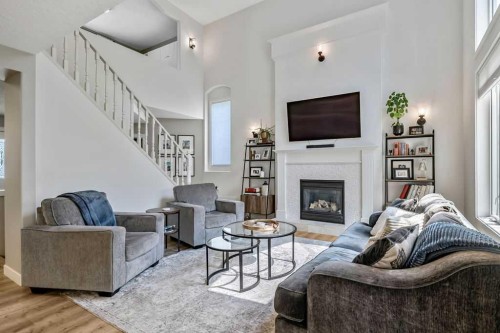 9 Sheep River Heath, Okotoks, AB - Indoor Photo Showing Living Room With Fireplace