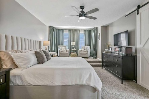 9 Sheep River Heath, Okotoks, AB - Indoor Photo Showing Bedroom