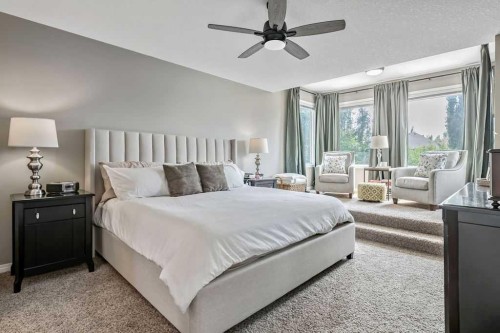 9 Sheep River Heath, Okotoks, AB - Indoor Photo Showing Bedroom