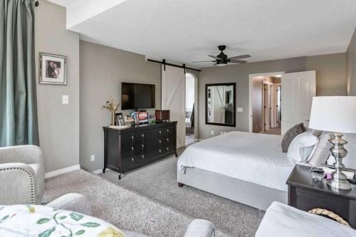 9 Sheep River Heath, Okotoks, AB - Indoor Photo Showing Bedroom