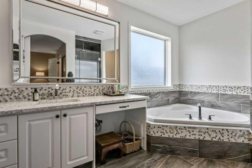 9 Sheep River Heath, Okotoks, AB - Indoor Photo Showing Bathroom