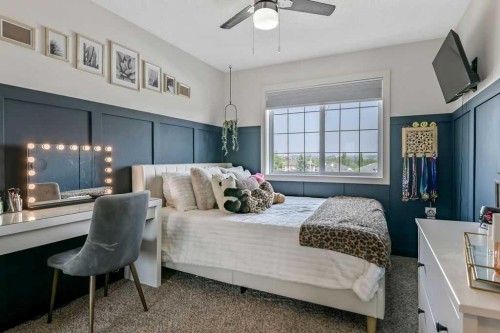 9 Sheep River Heath, Okotoks, AB - Indoor Photo Showing Bedroom