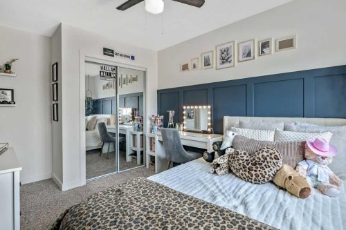9 Sheep River Heath, Okotoks, AB - Indoor Photo Showing Bedroom