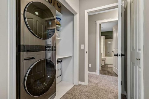 9 Sheep River Heath, Okotoks, AB - Indoor Photo Showing Laundry Room