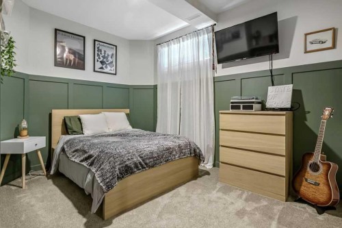 9 Sheep River Heath, Okotoks, AB - Indoor Photo Showing Bedroom