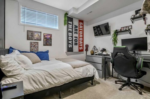 9 Sheep River Heath, Okotoks, AB - Indoor Photo Showing Bedroom