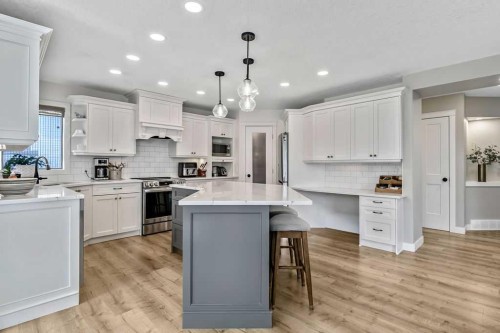 9 Sheep River Heath, Okotoks, AB - Indoor Photo Showing Kitchen With Stainless Steel Kitchen With Upgraded Kitchen
